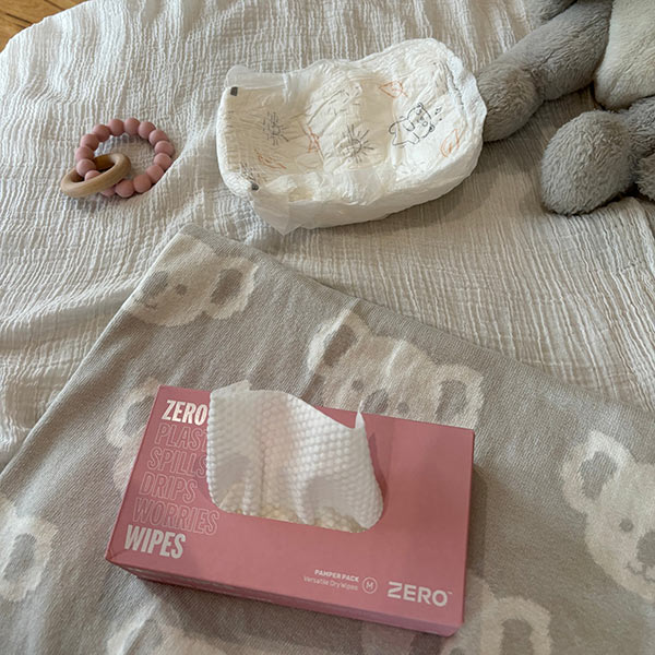 Zero Plastic Free Baby wipes medium box next to a clean nappy ready for nappy change