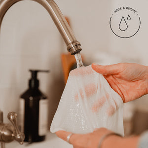 Plastic Free Cleaning wipe being wet under kitchen tap